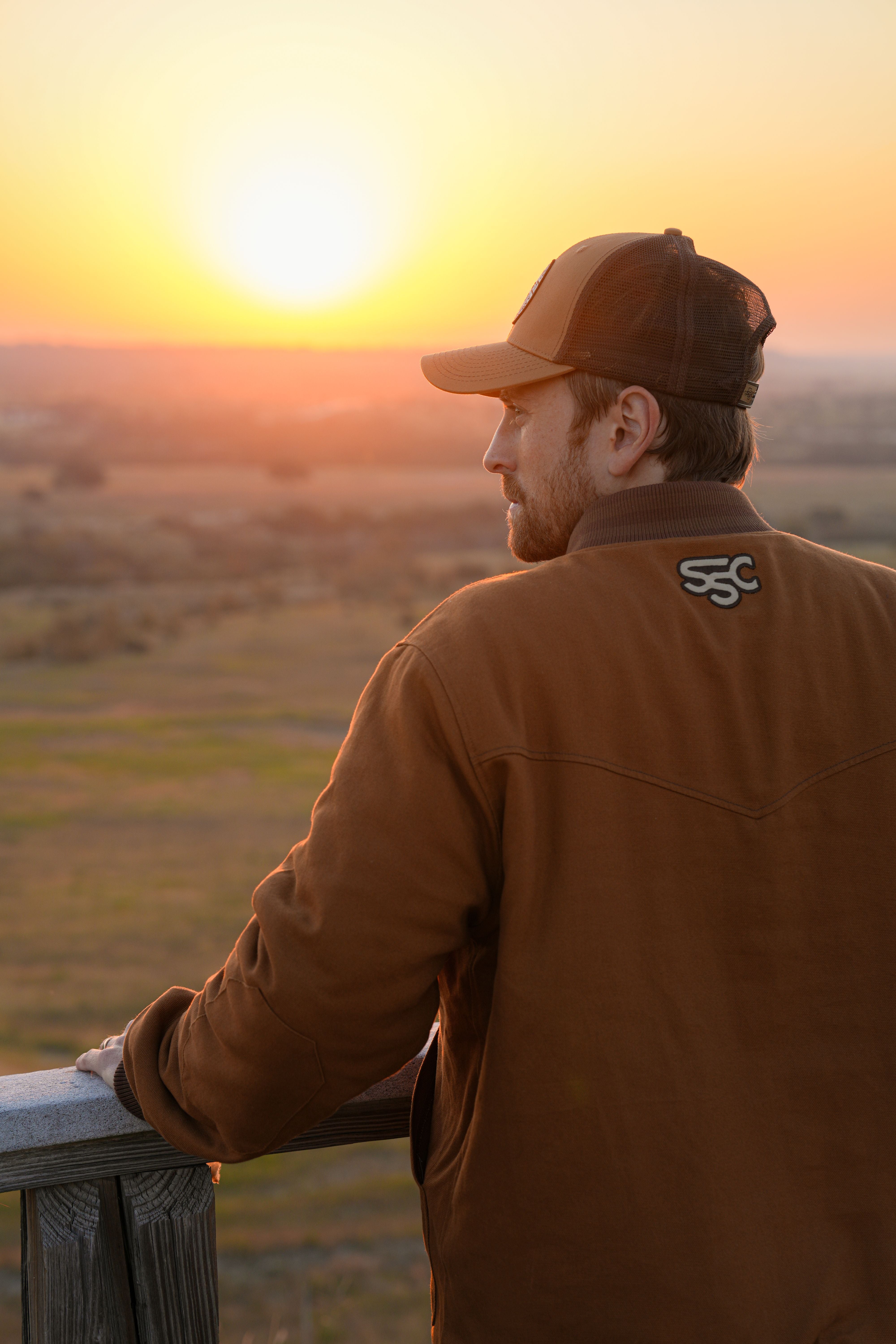 A single green leaf against a white background.