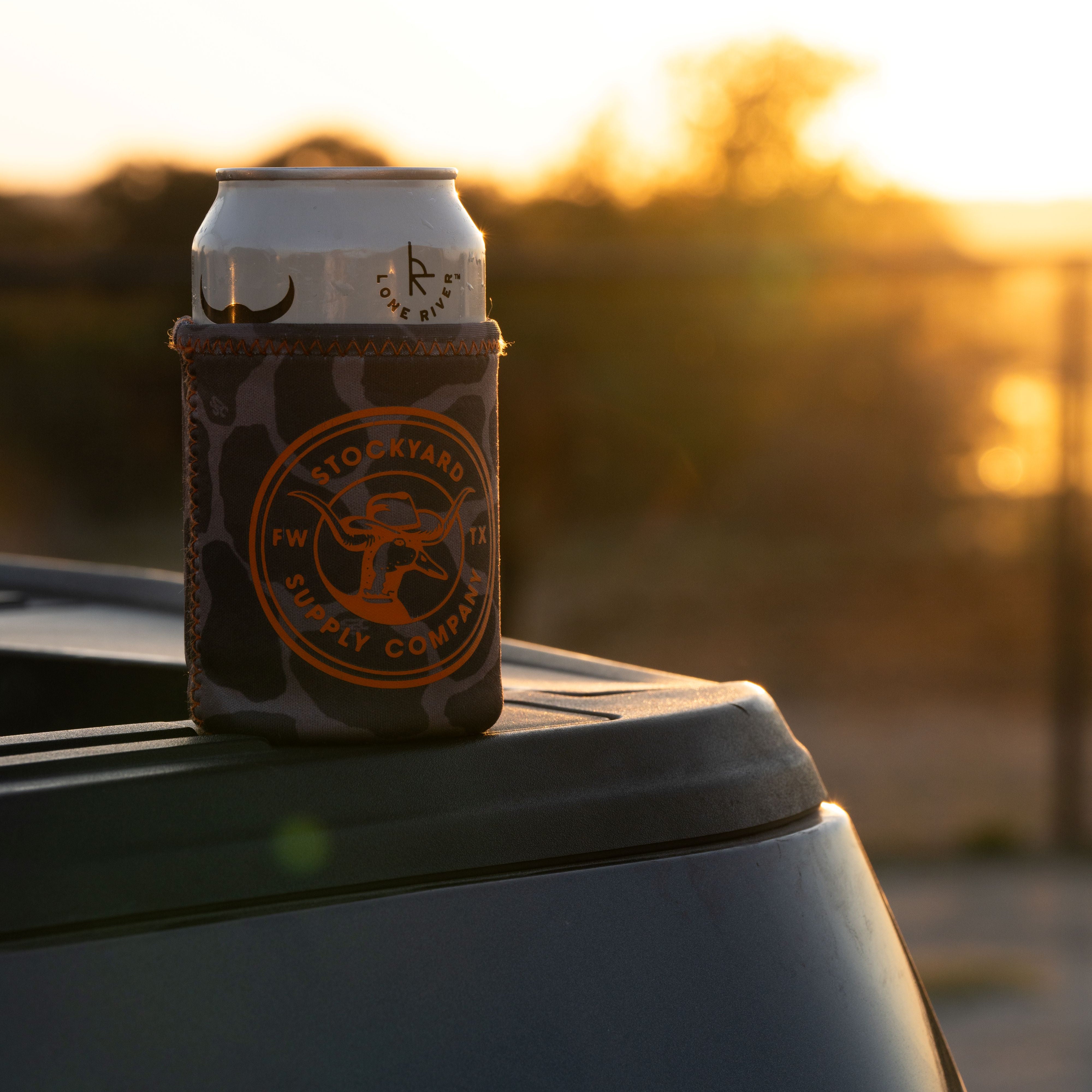 Duckster logo side of the coozie on a tailgate 